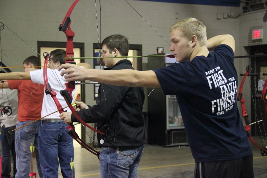 Outdoor Adventures students practice shooting targets during class
