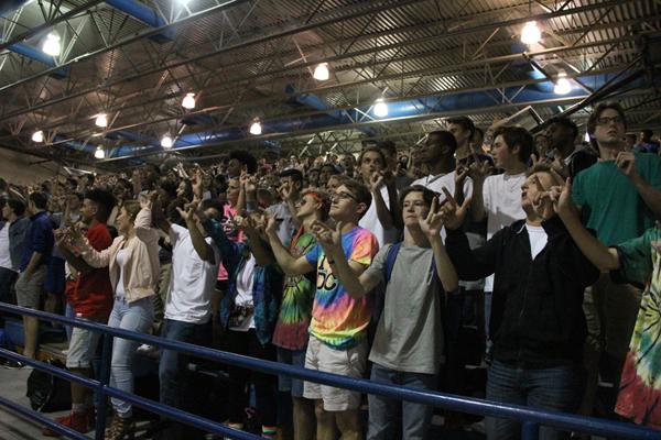 Students at pep rally during school song