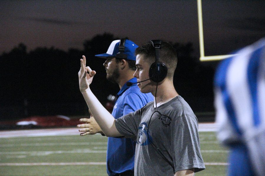 Matt Sandlin gives signals during the Van game