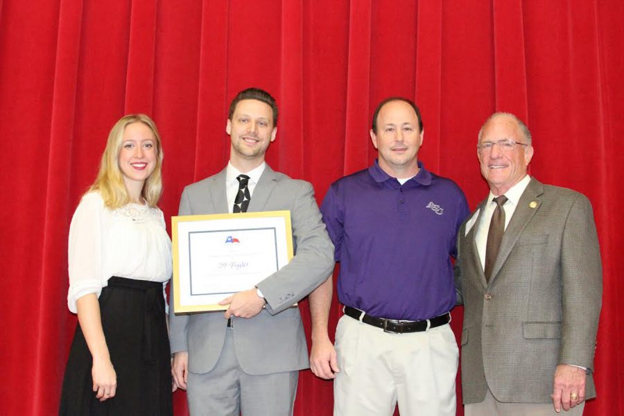 Mr. John Fugler receiving the Texas Outstanding Teaching of the Humanities from Texas Senator Bob Hall as well as Sam Moore.