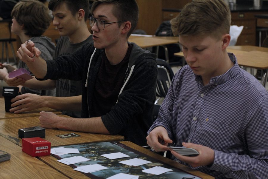Students trade cards in new club.