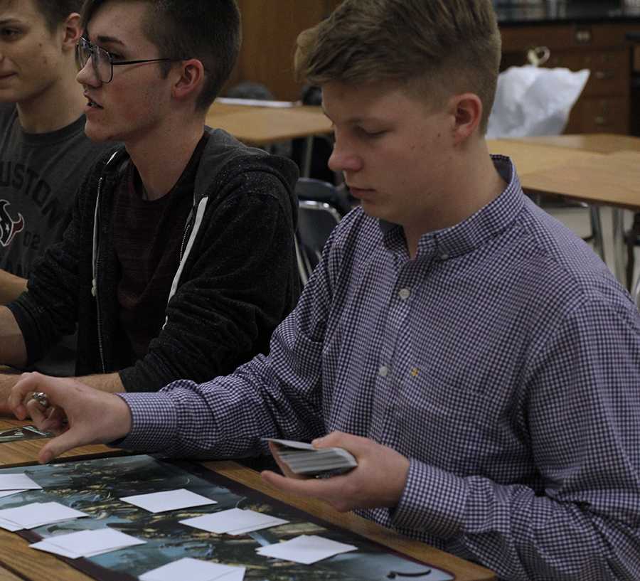 Coleman Allen plays a trading card game.
