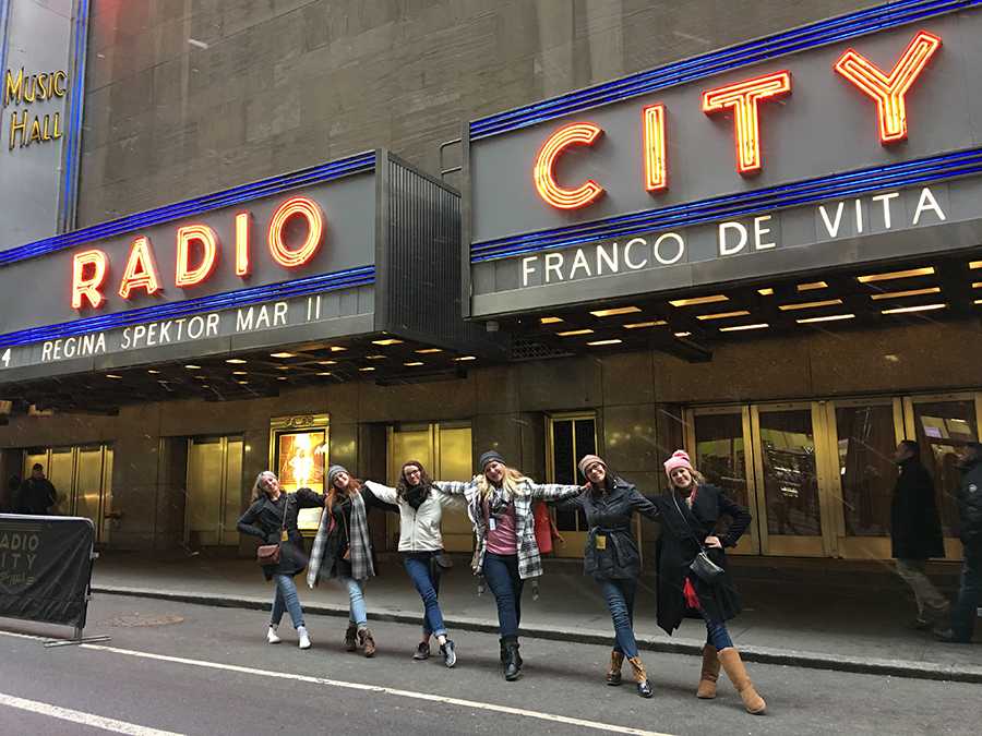 Star Steppers pose like Rockettes outside Radio City Music Hall.