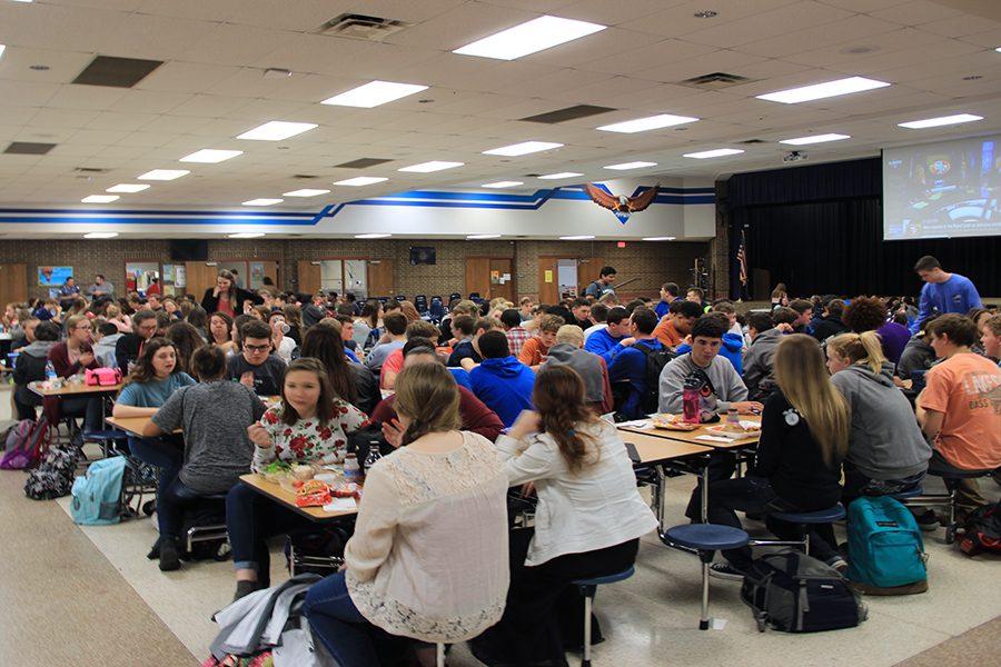 Students crowd the lunchroom. The performers practiced for weeks individually for several days before the showcase.