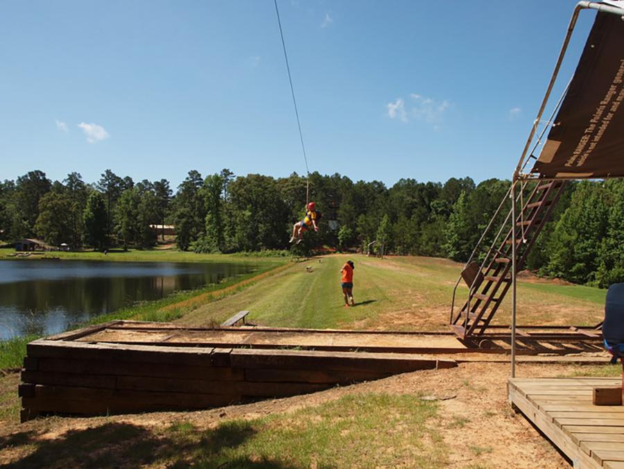 A camper enjoys the zipline at Timberline Baptist Camp and Conference, owned and operated by the family of sophomore Austin Roots.