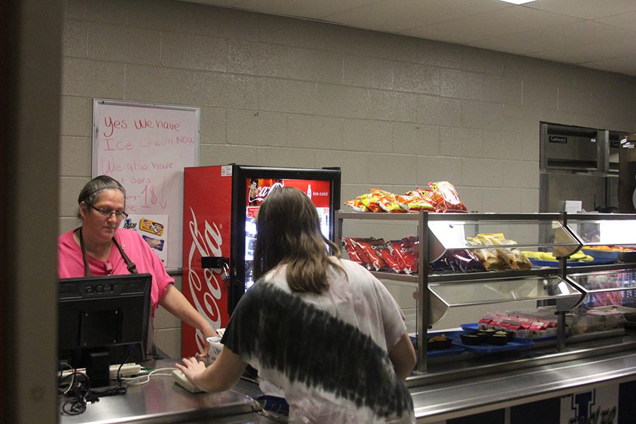 Students stand in line for lunch in the cafeteria