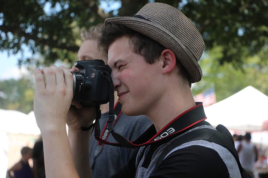 Freshmen Ben Roach takes photographs on an Art Club excursion in Ben Wheeler. Roach is talented in several artistic and musical aspects