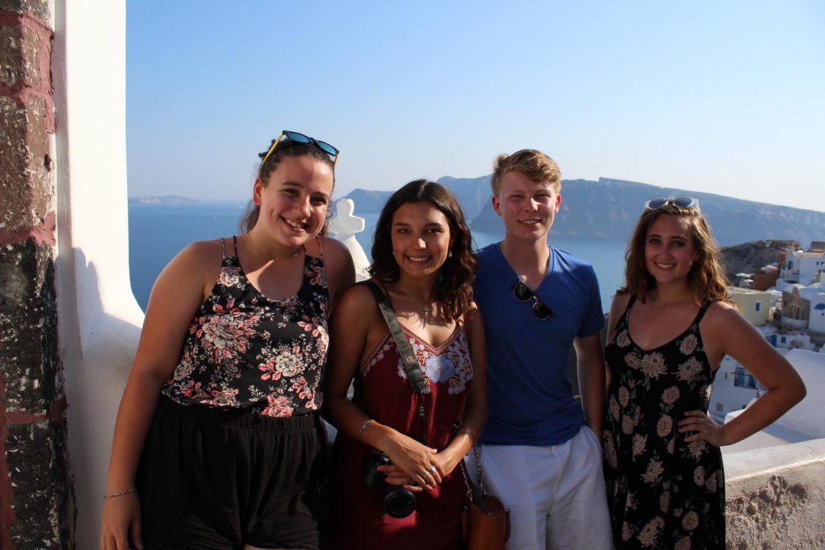 Addison+Baquet%2C+Morgan+Droblyn%2C+Coleman+Allen%2C+and+Julia+Austin+stand+with+their+backs+to+a+Greek+coastline.+The+students+viewed+these+stunning+vistas+as+the+travelled+across+the+Mediterranean.+