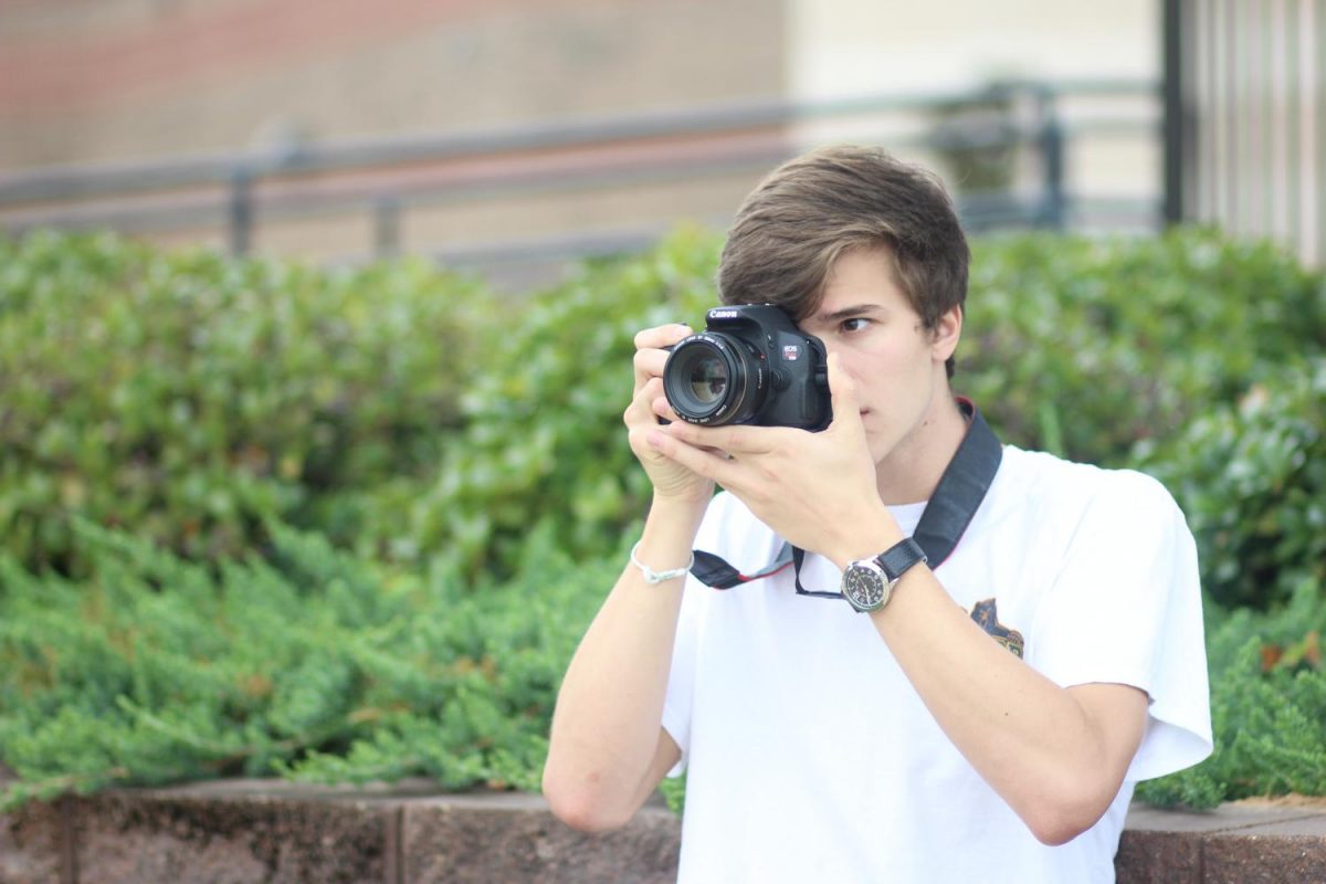Senior Anthony Wyatt takes pictures around the school in preparation for his trip to Costa Rica. He attended a photography class in Costa Rica over the summer.