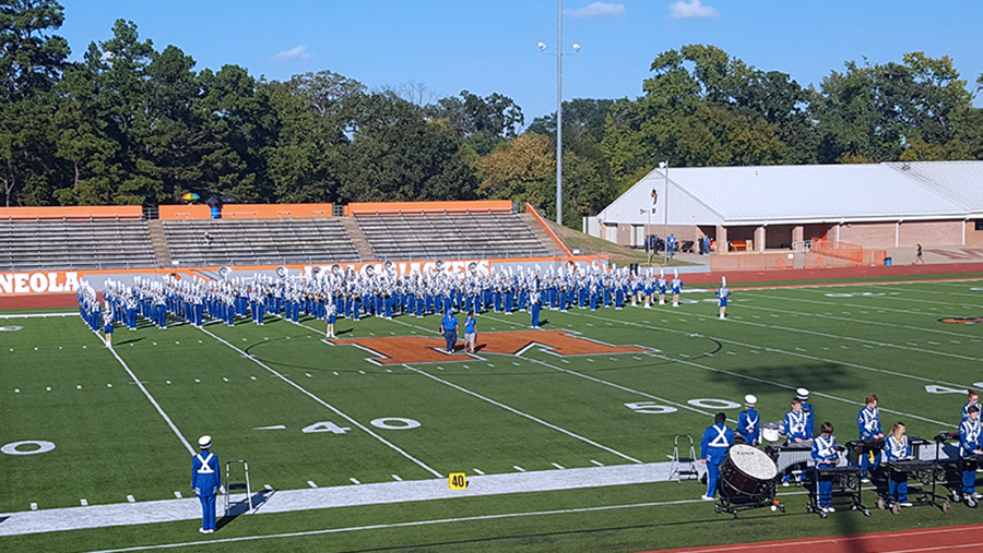 The band prepares to perform at the Mineola Marching Band Festival. Lindale was the only military band to advance to finals, ultimately placing fifth overall.