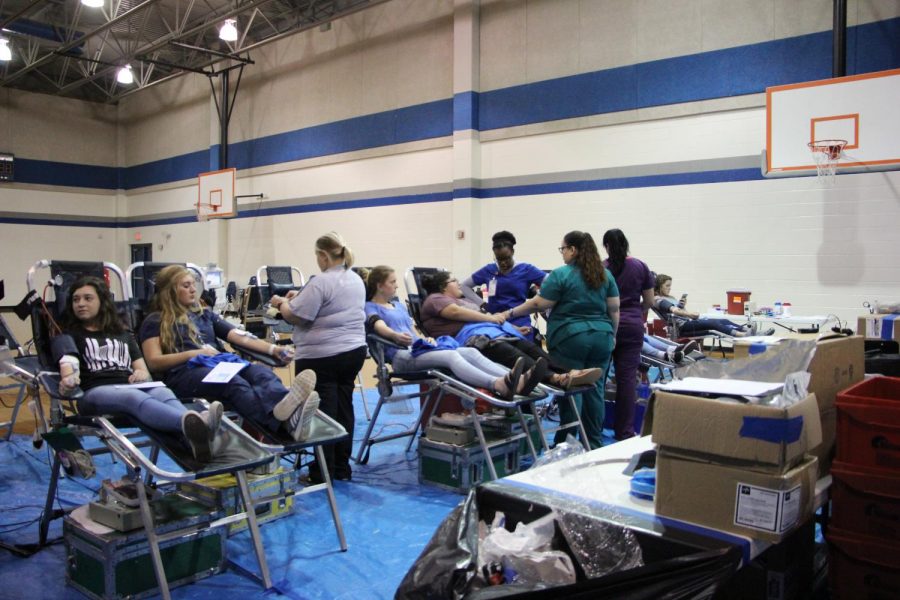 Students donate blood in the gym. The blood donated will go to several hospitals around the area.