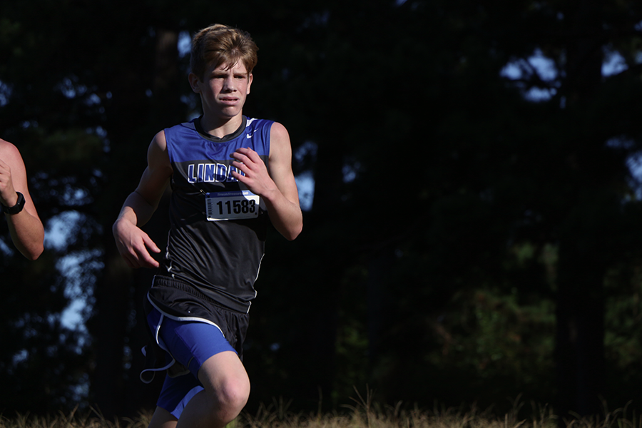 Freshman Colton Taylor runs for a place at the home meet. Taylor is advancing to the regional meet. 