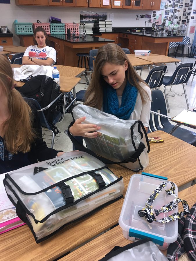 Junior Kaitlyn Barrington attends training for Junior Achievement. She received a teachers kit to prepare on her own for class.  