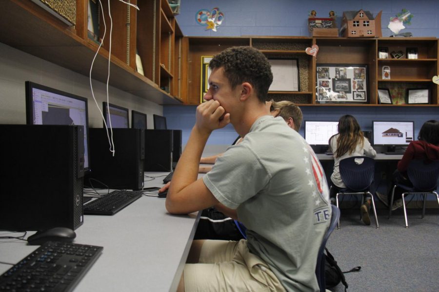 Joe Noble works on a computer project in Mrs. Wheats class. In this instance he is utilizing visual learning. 