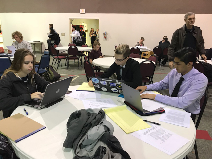 Debate team members prepare for contest at the Regional Meet for Congressional Debate. Lindale students placed first through fourth at the competition. 