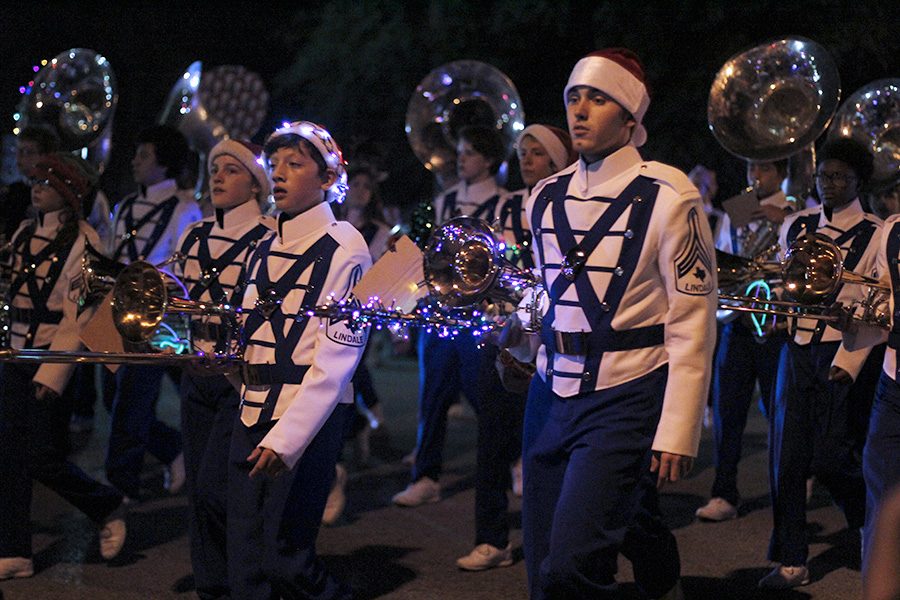 The band marches at the annual Christmas Parade. The upcoming Christmas concerts by band and choir are continued displays of Christmas cheer.