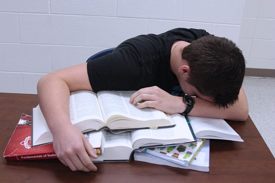 Senior Josh Martin exhausts himself working on homework. Eventually, he completed the work, though it was not of the quality he hoped.