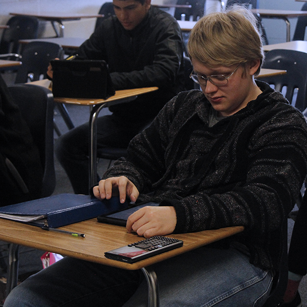 Senior Tyler Meador works on calculus homework during class. He is currently the salutatorian of the senior class.