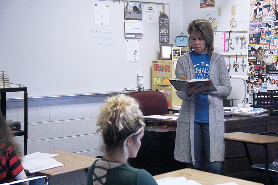 Mrs. Ramsey reads to her AP history class. She has been apart of Academic Rodeo for 8 years.