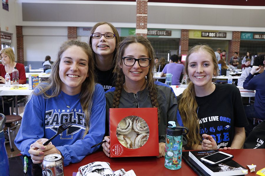 The Lindale journalism team poses with a gift from sponsor Neda Morrow. The team competed at Magnolia for regionals last season.