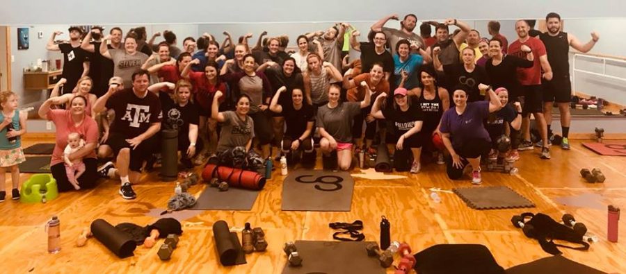 Camp Gladiator participants flex after an intense workout. Campers have the ability to meet daily from a diverse number of locations across Texas, Colorado, North Carolina, Louisiana and Florida.
