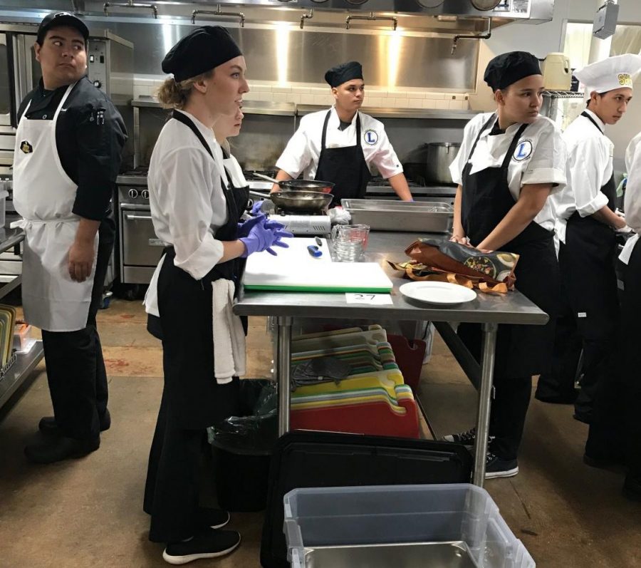 Culinary competitors in the kitchen at Austin. The team won a $500 scholarship each to Auguste Escoffier School of Culinary Arts.