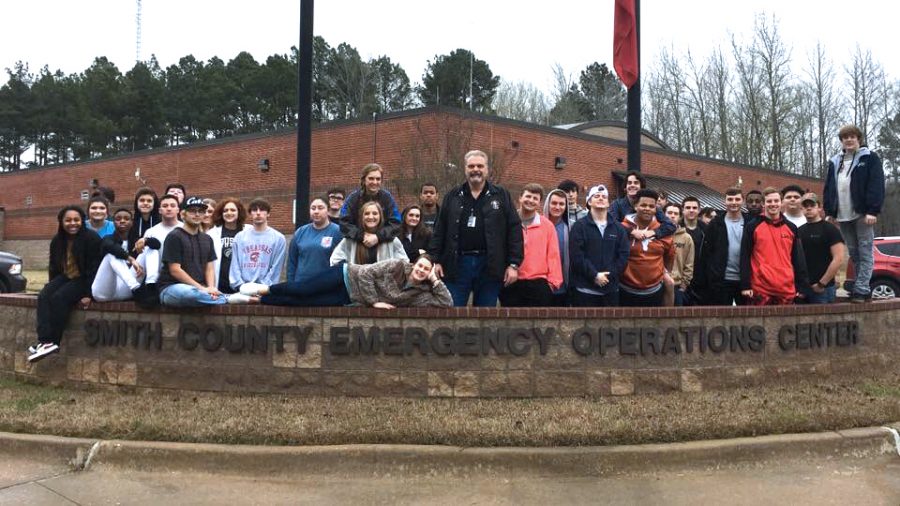 Johnson and his Law ll students pose in front of the emergency operations center. Students met with staff, toured facilities and discussed entry level jobs, salaries and benefits.