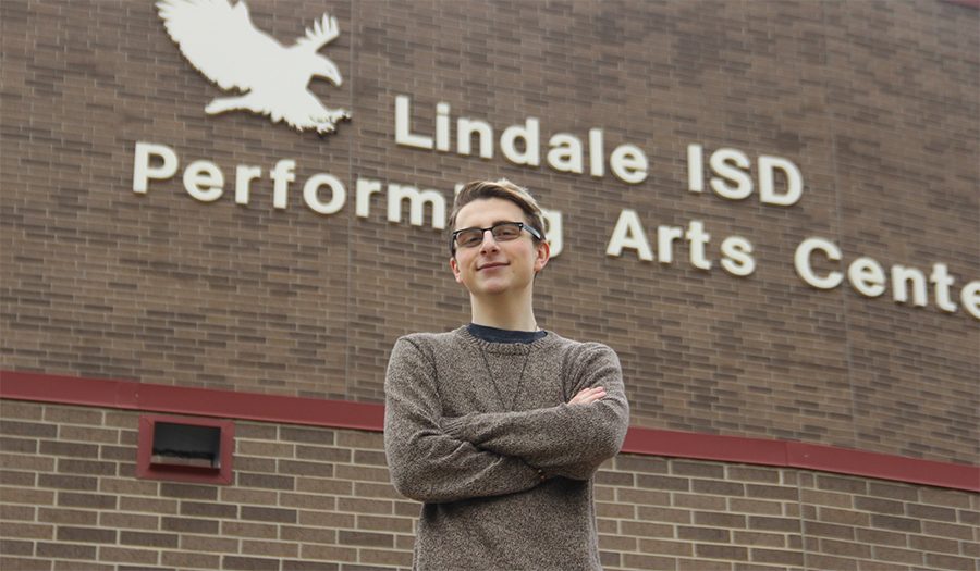 Senior Evan Bewersdorf poses outside the Performing Arts Center. Bewersdorf proposed that the building be named after a former Lindale educator.