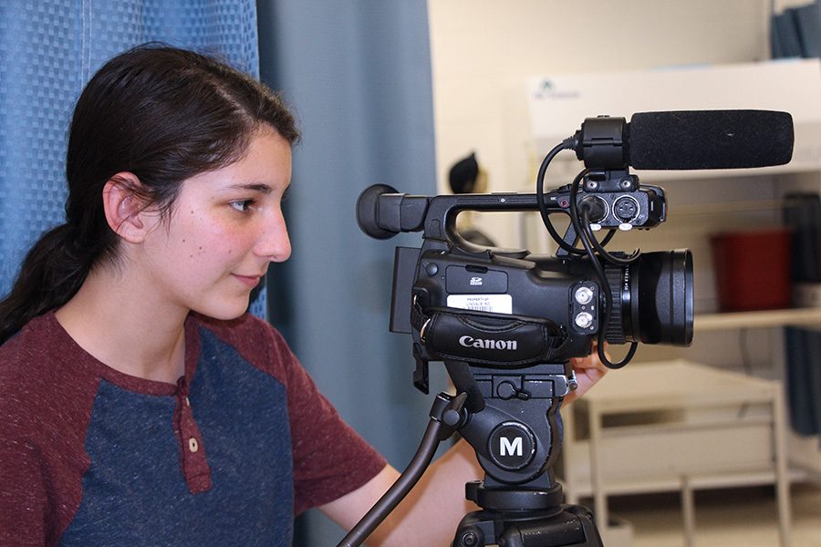 Junior Sophie Taylor films a scene of the movie. She had been learning about film and working with cameras for several years before this.