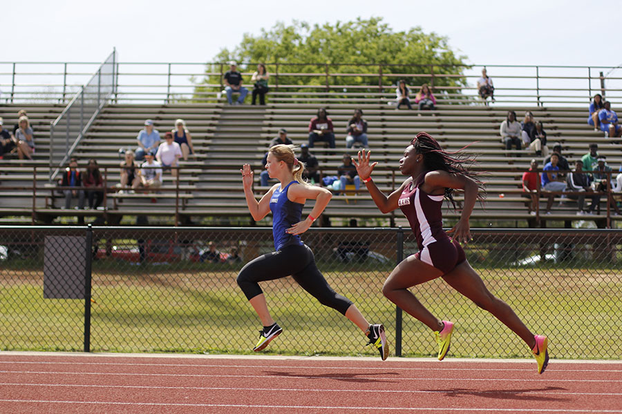 Junior Moriah Franke runs the 200 at the district meet. The varsity girls placed third overall. 