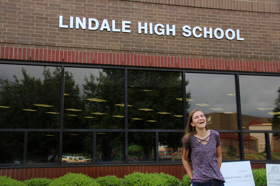 Kaitlyn Barrington shares a laugh in front of the high school. She will enter her senior year next semester.