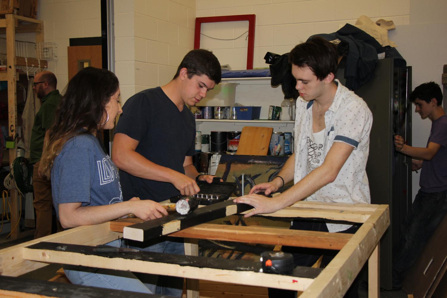 (From left to right) freshman Murphy Churchill, senior Matthew Henderson and junior Simon Young work on their project. The group decided to construct a car.