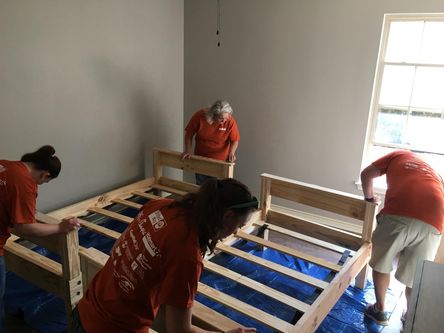 Volunteers help set up the Hope Haven house for East Texas teen girls in the foster care system. Sixteen beds were built.
