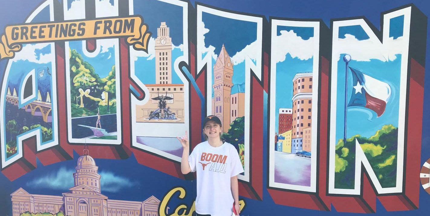 Undergraduate Sarah Huseth poses in front of the Austin mural to show off her college pride. She recently was got accepted as Assistant Editor to the UT Austin yearbook staff.