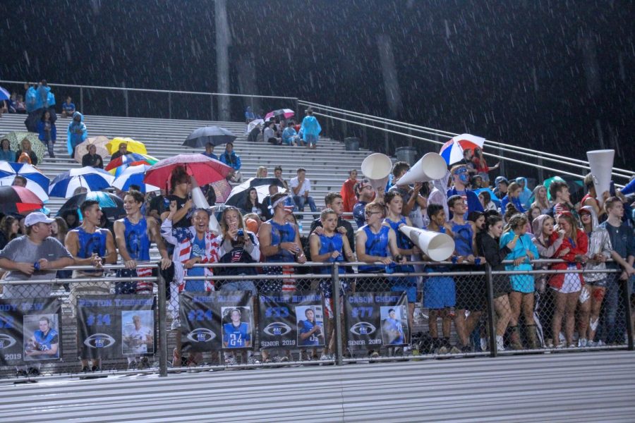The Flock cheers on the varsity football boys at their game Friday against Forney. Despite the rain showers, the Flock was out in full force for the game.