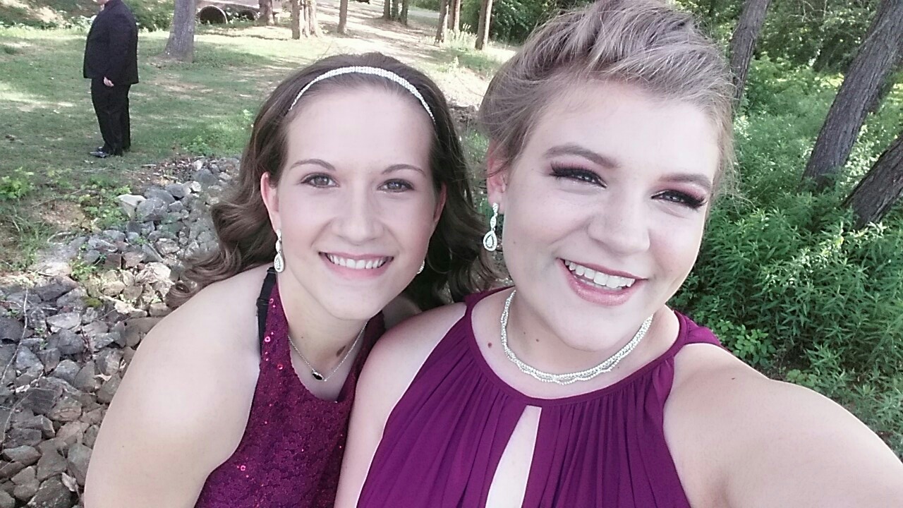Gill poses with her friend  before prom.