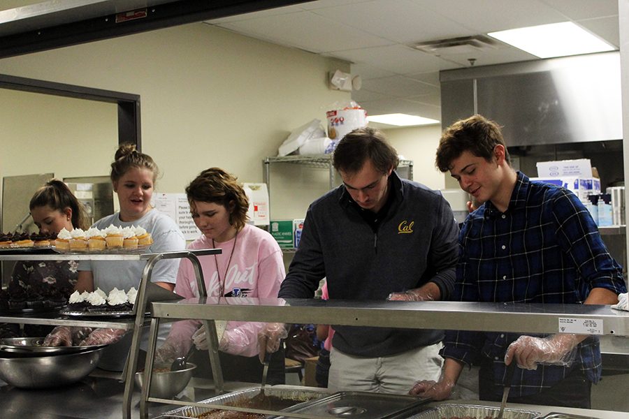 Theatre students serve the community. They worked in assembly line fashion. 