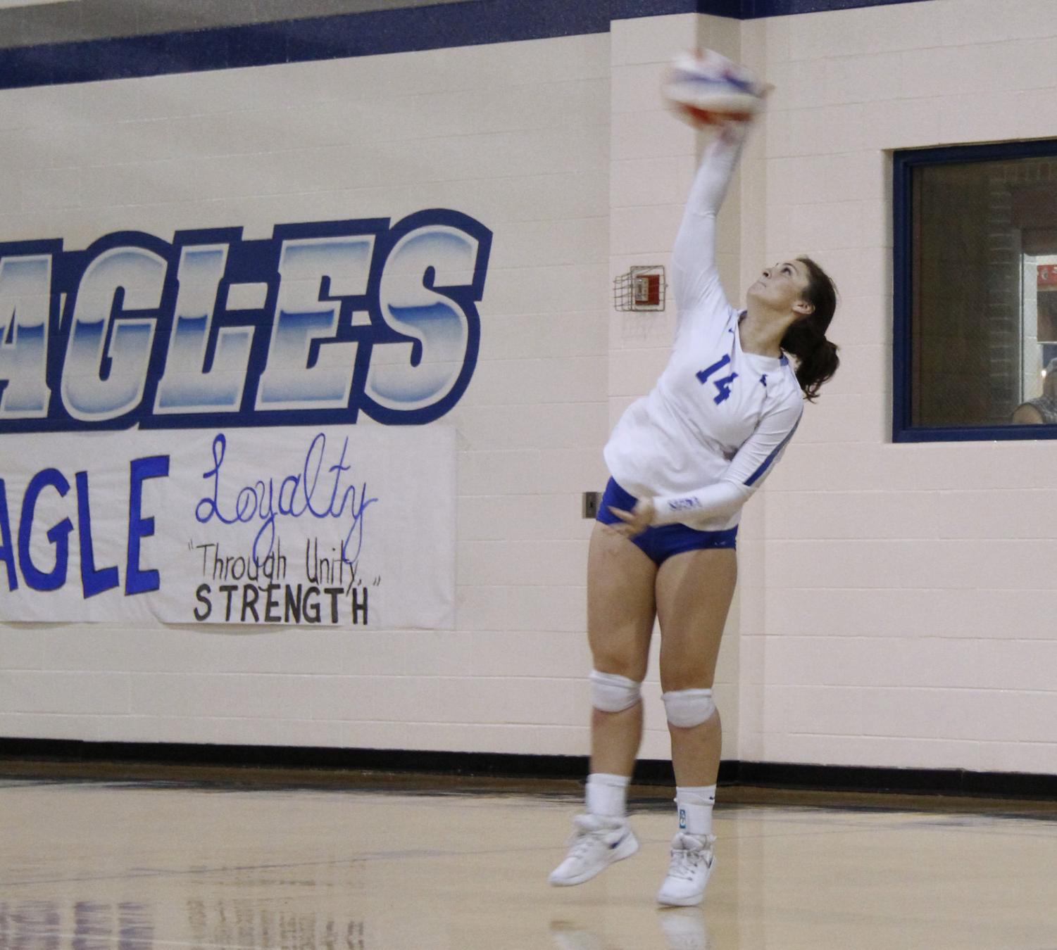 Senior Hannah Knox serves the ball across the net. The varsity volleyball team will play Lufkin at Robert E. Lee High School on Tuesday in the bi-district round of the playoffs.