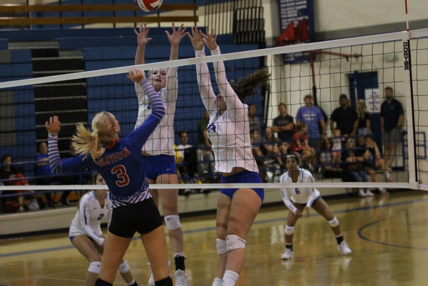 Two Lindale players jump up to block a spike. All three teams beat Gilmer in the non-district game.