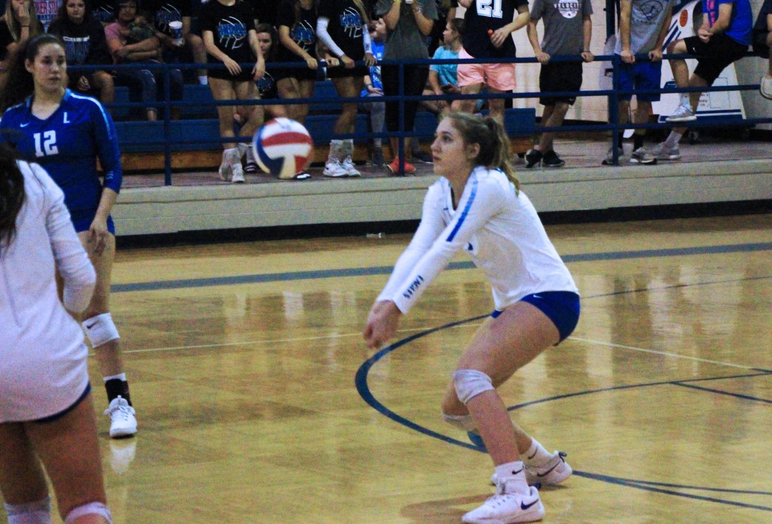 Sophomore Shelbi Steen passes the ball to her teammates. The team beat North Lamar at home in four sets.