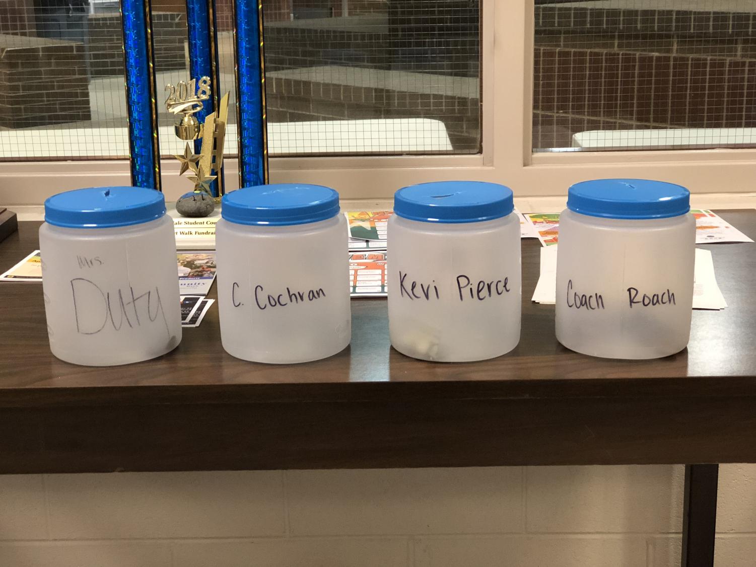 English teacher Cara Duty, head football coach Chris Cochran, math teacher and drill team sponsor Keri Pierce, and football coach and social studies teacher Jacob Roach have volunteered to be pied. Whoever's jar recieves the most donations will recieve a pie to the face at the November 2 pep rally.