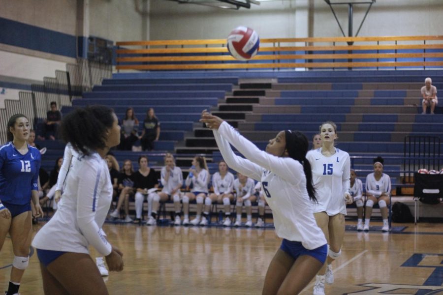 Sophomore Kalaya Pierce bumps the ball backwards so her team can further play the ball. The varsity team beat Sulphur Springs in four sets, while the JV team squeaked out a 2-1 win.