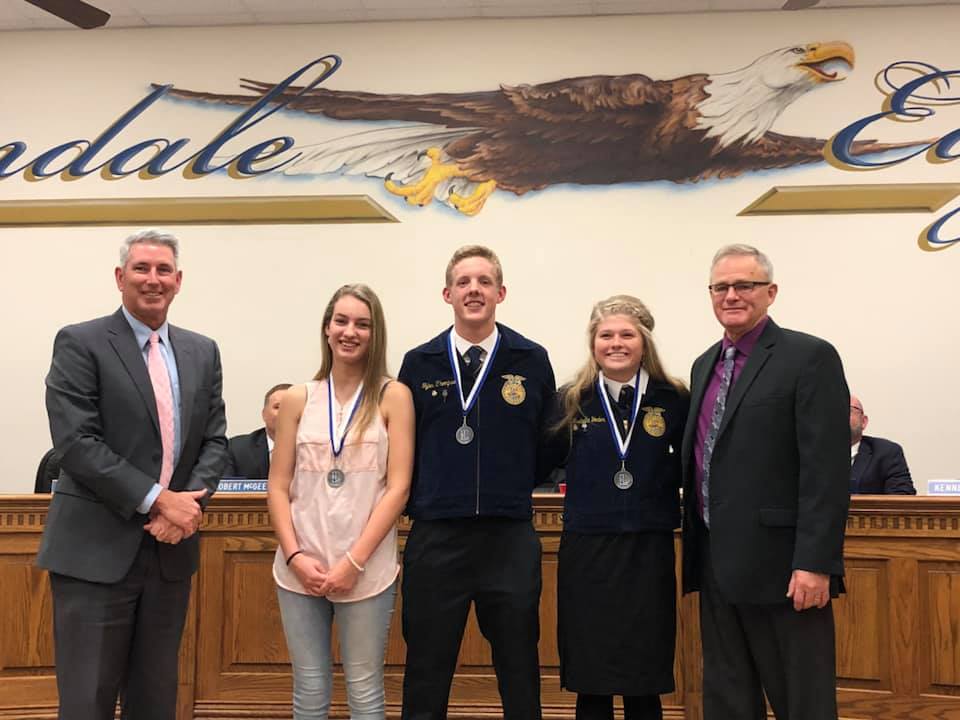 Jayden Gregory, Tyler Thompson and Bella Yoder were recognized in front of the school board for their achievements at the Mineola District Convention.