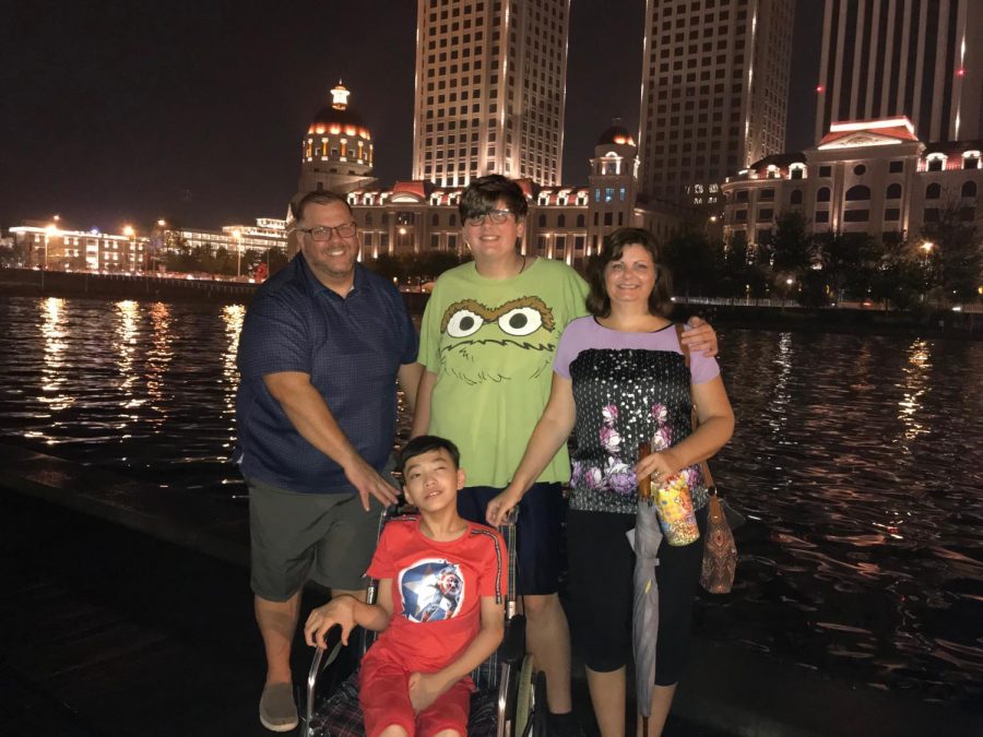 Luke poses with his family after they adopt Lin from Tianjin. Lin will leave the next day to be welcomed to his new home in the United States.