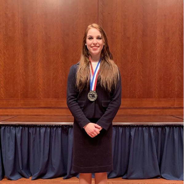 Ashlyn Ellgass with the silver medal she received at state for congress debate. The competition was held January 7-9 in Austin.