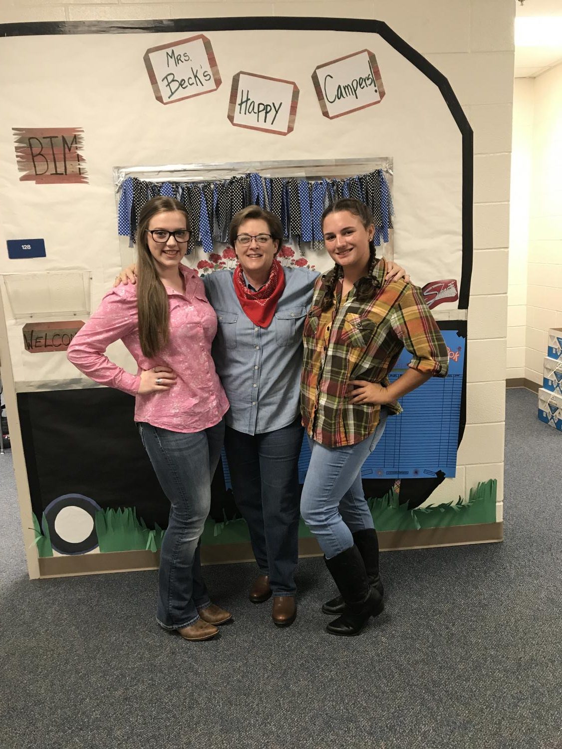 Teacher Lynda Beck celebrates western day with students Alanna Kologey and Keslie Cook. Beck has participated in numerous spirit days during her years at LHS.