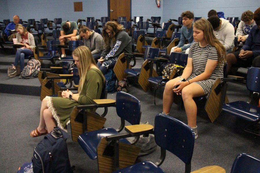 Students join each other in prayer during a weekly meeting. The meeting took place on March 21.
