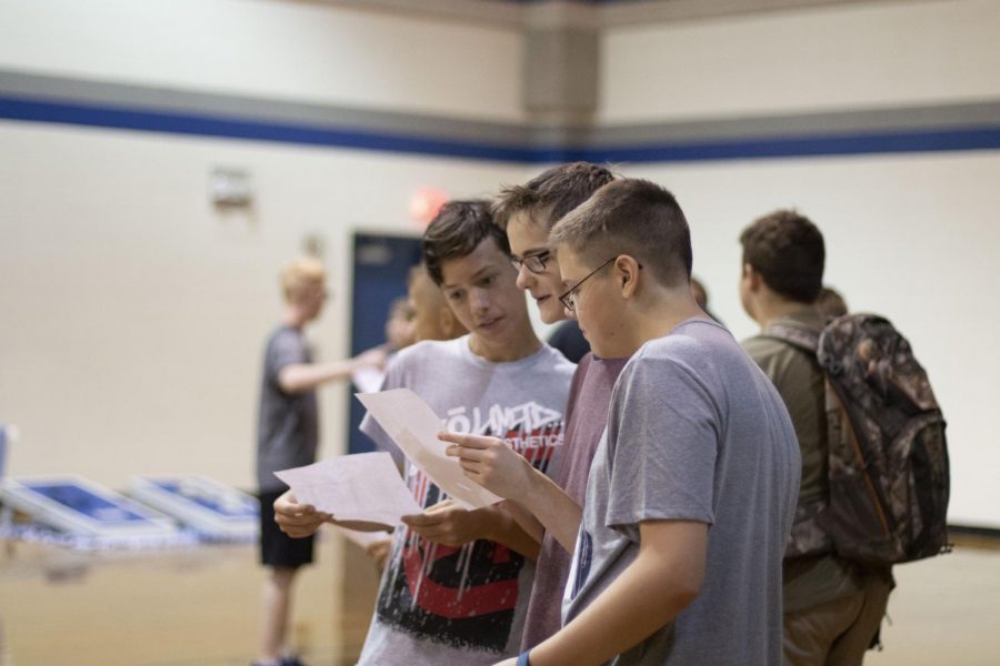 Freshman compare their schedules during Fish Camp.