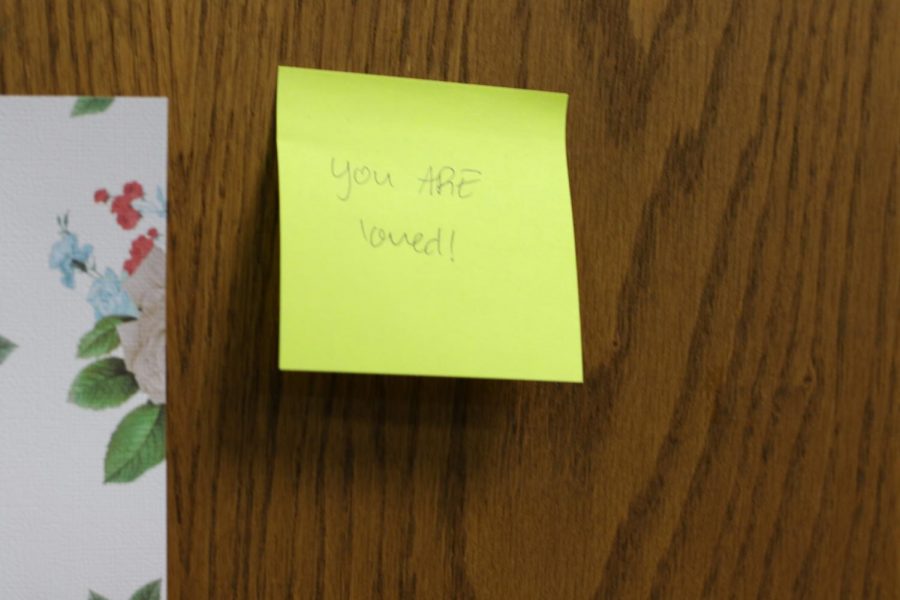 Positive sticky note on the door of the library. They can be found here, doors of classrooms, and in the foyer. 