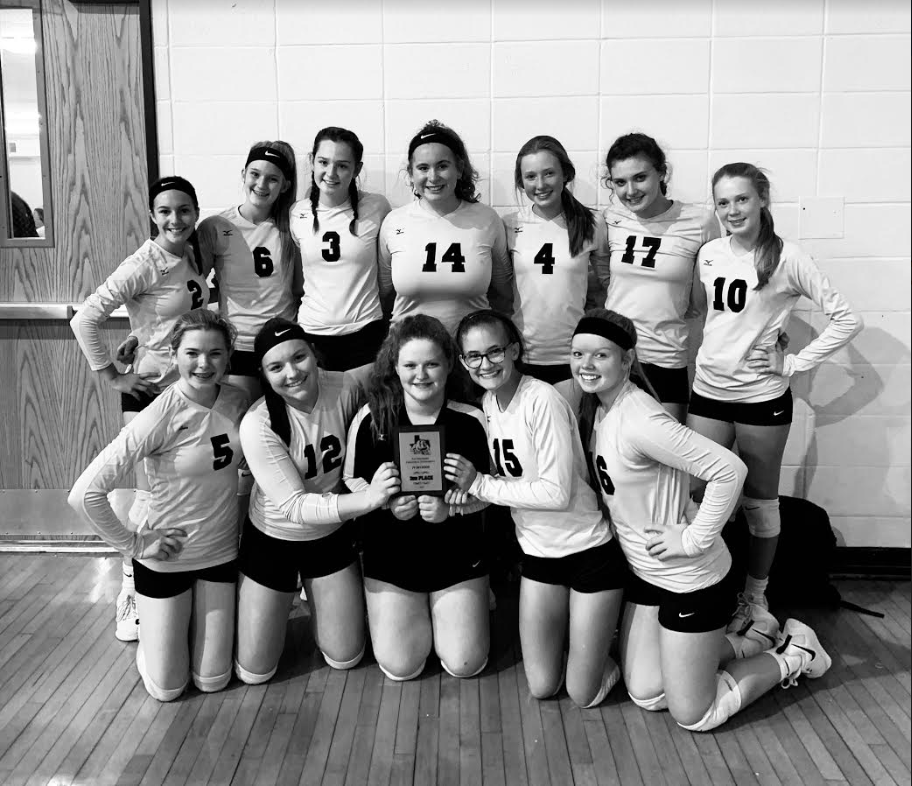 The freshman volleyball team poses with their plaque following a tournament in Quitman. They placed third at the event.